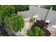 Home with manicured lawn, driveway, mature trees, and well-maintained landscaping at 1614 Rosebud Ln # 83, Greenwood, IN 46143
