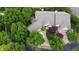 Beautiful home featuring mature trees, lush landscaping, and an inviting driveway at 1614 Rosebud Ln # 83, Greenwood, IN 46143