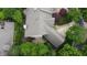 Home featuring mature trees, lush landscaping, hardscape patio, and well-kept surroundings at 1614 Rosebud Ln # 83, Greenwood, IN 46143