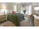 Well-lit bedroom featuring a large window, plush bedding, and ample space at 1614 Rosebud Ln # 83, Greenwood, IN 46143