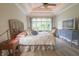 Serene bedroom featuring a comfortable bed, a large window, and a modern TV at 1614 Rosebud Ln # 83, Greenwood, IN 46143