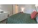 Bright bedroom featuring a large plush bed, dresser, and bedside table at 1614 Rosebud Ln # 83, Greenwood, IN 46143