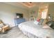 Well-lit bedroom featuring a comfortable bed, stylish decor, and neutral wall color for a relaxing ambiance at 1614 Rosebud Ln # 83, Greenwood, IN 46143