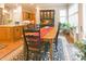 Cozy dining area with an adjacent view to the kitchen with hardwood floors and natural light at 1614 Rosebud Ln # 83, Greenwood, IN 46143