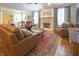 Spacious living room with fireplace, hardwood floors, and comfortable seating at 1614 Rosebud Ln # 83, Greenwood, IN 46143