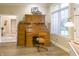 Office with hardwood floors, natural light, and a beautiful roll top desk at 1614 Rosebud Ln # 83, Greenwood, IN 46143
