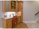 Cozy office space with custom cabinets, granite countertops, and a charming red chair at 1614 Rosebud Ln # 83, Greenwood, IN 46143