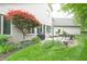 Brick house backyard with a patio set with furniture at 1614 Rosebud Ln # 83, Greenwood, IN 46143