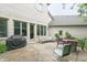 Brick house backyard with a patio set with furniture at 1614 Rosebud Ln # 83, Greenwood, IN 46143