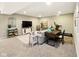 Cozy finished basement with carpet flooring, tv area and adjacent workout space at 165 N Bend Dr, Greenwood, IN 46142