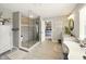 Bathroom with a glass-enclosed shower, vanity, and a view of the main bedroom at 165 N Bend Dr, Greenwood, IN 46142