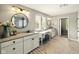 Bright bathroom featuring dual vanities, granite countertops, and decorative mirrors at 165 N Bend Dr, Greenwood, IN 46142