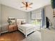 Neutral bedroom featuring a white bed frame, soft carpet, and a window with natural light at 165 N Bend Dr, Greenwood, IN 46142