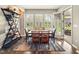 A well-lit dining room features hardwood floors and large windows with white shutters at 165 N Bend Dr, Greenwood, IN 46142