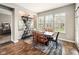 Charming dining room with rustic wood table, shelving unit, and ample natural light at 165 N Bend Dr, Greenwood, IN 46142