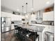 Modern kitchen with white cabinets, granite countertops, stainless appliances, and a large island at 165 N Bend Dr, Greenwood, IN 46142