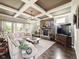 Spacious living room with coffered ceilings, stone fireplace, and an abundance of natural light at 165 N Bend Dr, Greenwood, IN 46142