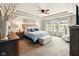 Serene main bedroom with tray ceiling, plush bedding, and ample natural light at 165 N Bend Dr, Greenwood, IN 46142
