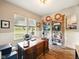 Bright office space features a large wooden desk, built-in shelving and two big windows at 165 N Bend Dr, Greenwood, IN 46142
