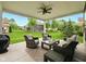 Inviting outdoor patio with comfortable seating and a ceiling fan overlooking a well-maintained backyard at 165 N Bend Dr, Greenwood, IN 46142