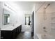 Updated bathroom featuring a vanity, sleek fixtures, shower-tub combo, and bright lighting at 17696 Arryne E Dr, Noblesville, IN 46062