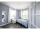 Cozy bedroom features a twin bed, natural light, and neutral paint at 17696 Arryne E Dr, Noblesville, IN 46062