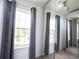 Bedroom featuring natural lighting from two windows and floor to ceiling mirror at 17696 Arryne E Dr, Noblesville, IN 46062