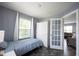 Bedroom features a single bed, white wardrobe, and neutral-colored walls at 17696 Arryne E Dr, Noblesville, IN 46062