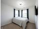 Clean bedroom with a bed, large windows with curtains, and a TV at 17696 Arryne E Dr, Noblesville, IN 46062