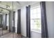 Bedroom featuring natural lighting from two windows and floor to ceiling mirror at 17696 Arryne E Dr, Noblesville, IN 46062