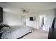 Bright bedroom featuring a ceiling fan, mounted television and neutral decor at 17696 Arryne E Dr, Noblesville, IN 46062