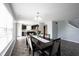 Dining room with modern chandelier and sight lines into kitchen at 17696 Arryne E Dr, Noblesville, IN 46062