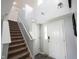 Bright foyer with high ceilings and a staircase leading to the upper level of the home at 17696 Arryne E Dr, Noblesville, IN 46062