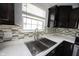 Close up of kitchen sink with stainless steel faucet and white countertops at 17696 Arryne E Dr, Noblesville, IN 46062