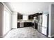 Modern kitchen with stainless steel appliances and dark wood cabinets at 17696 Arryne E Dr, Noblesville, IN 46062