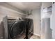 Laundry room showcasing modern washer and dryer set with storage space at 17696 Arryne E Dr, Noblesville, IN 46062