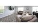 Comfortable living room features a large sectional sofa, recessed lighting, and modern finishes at 17696 Arryne E Dr, Noblesville, IN 46062