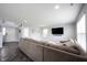 Comfortable living room features a large sectional sofa, recessed lighting, and modern finishes at 17696 Arryne E Dr, Noblesville, IN 46062
