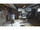 Unfinished basement featuring exposed piping, concrete walls, and utility components at 1802 Woodlawn Ave, Indianapolis, IN 46203
