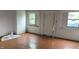 Bright bedroom featuring hardwood floors and plenty of natural light, ready for customization and personalization at 1802 Woodlawn Ave, Indianapolis, IN 46203