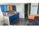 This kitchen features blue cabinets, light countertops, and a stainless steel sink at 1802 Woodlawn Ave, Indianapolis, IN 46203
