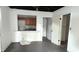 A room, featuring an interior pass-through to a kitchen, offers possibilities for an open-concept living space at 1802 Woodlawn Ave, Indianapolis, IN 46203