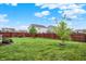Spacious backyard with a manicured lawn and privacy fence, perfect for outdoor activities and relaxation at 18258 Rickety Dr, Westfield, IN 46074