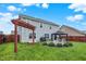 Spacious backyard featuring lush lawn, a patio seating area, gazebo, and a swing set at 18258 Rickety Dr, Westfield, IN 46074
