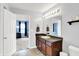 Bathroom vanity and access to the primary bedroom, which is nicely illuminated at 18258 Rickety Dr, Westfield, IN 46074