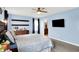 A well-lit bedroom that includes a dresser, decorative shelves, and bathroom access at 18258 Rickety Dr, Westfield, IN 46074