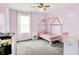 room featuring a playhouse style bed, a window and pink paint at 18258 Rickety Dr, Westfield, IN 46074
