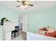 A bright bedroom featuring a white desk with shelves, a bed with pillows and a comforter at 18258 Rickety Dr, Westfield, IN 46074