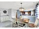 Charming dining room with a wooden table, white chairs, and a decorative wreath at 18258 Rickety Dr, Westfield, IN 46074