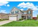 Charming two-story home with a combination of siding and brick, enhanced by dark shutters and a well-manicured lawn at 18258 Rickety Dr, Westfield, IN 46074
